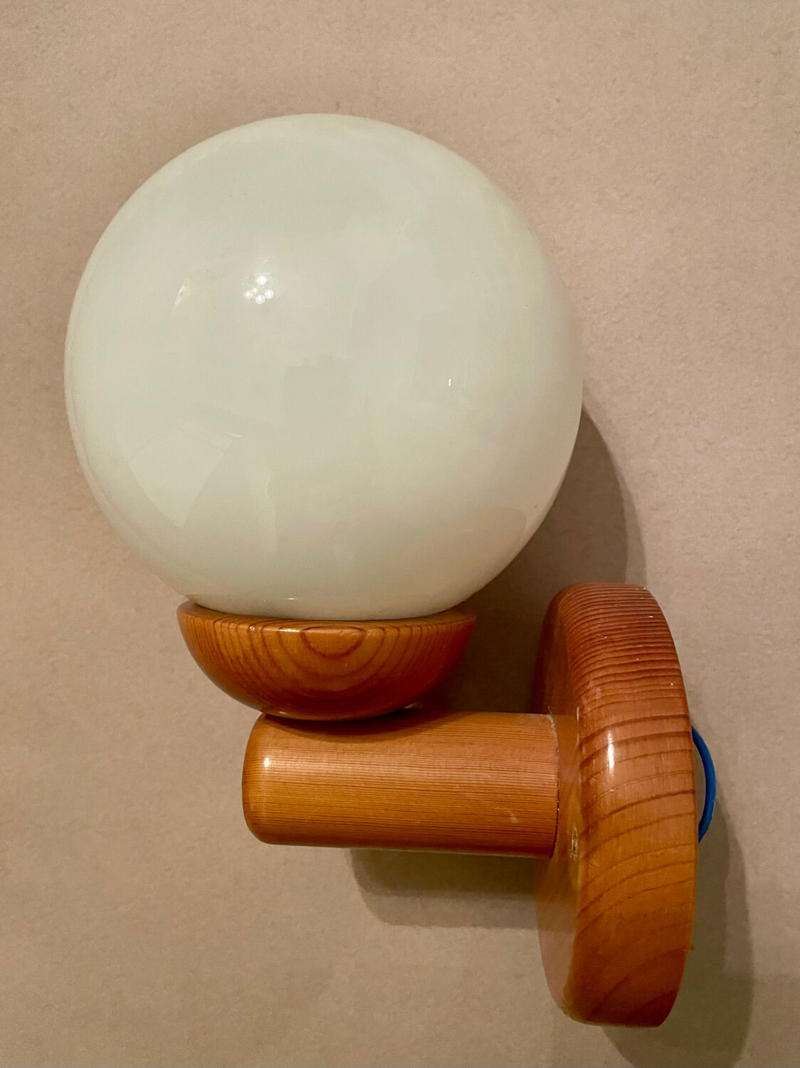 Vintage white glass wall light and pin.