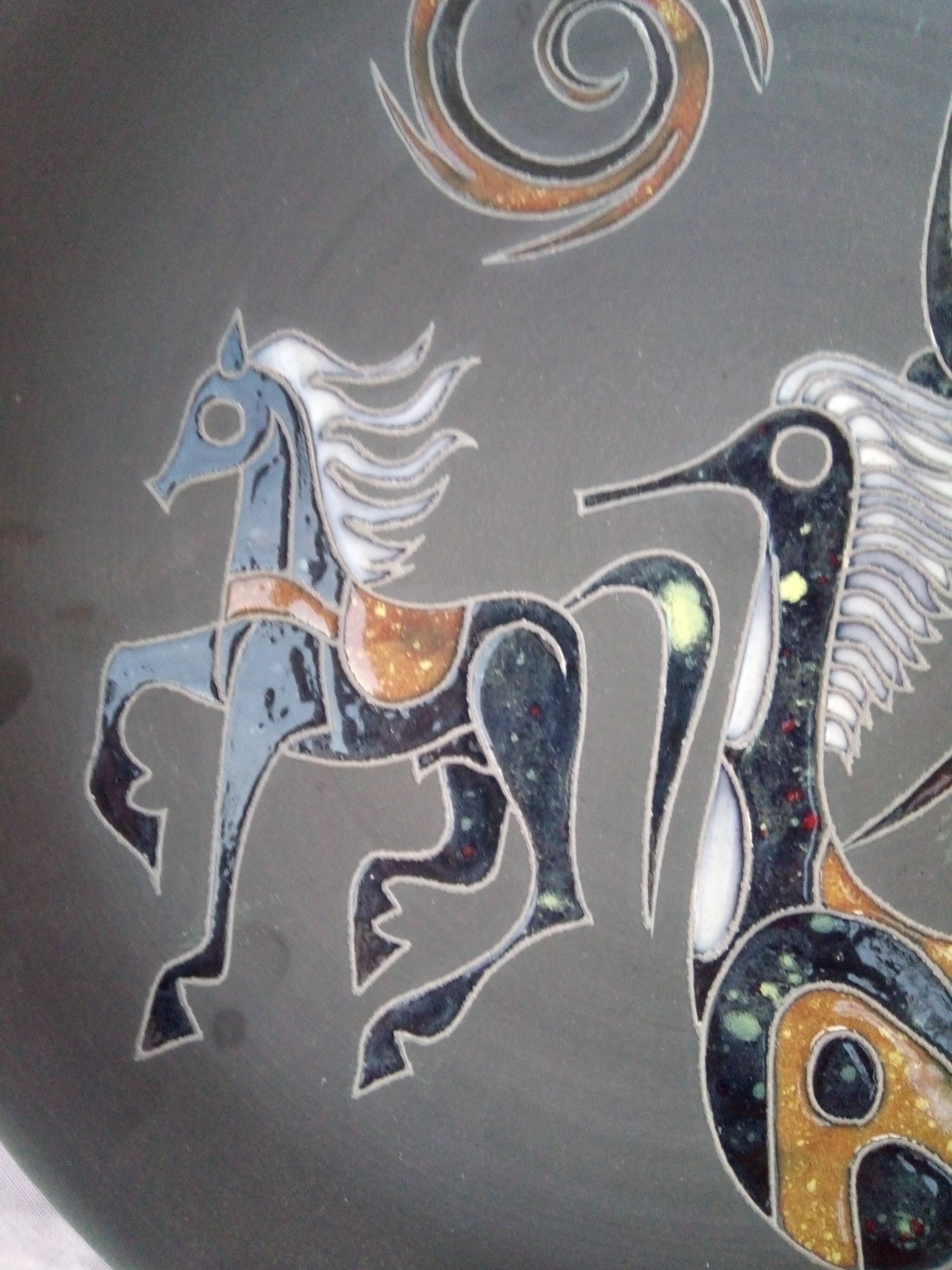 Rare pair of ceramic plates and enamel with mythological decoration. The 50s.