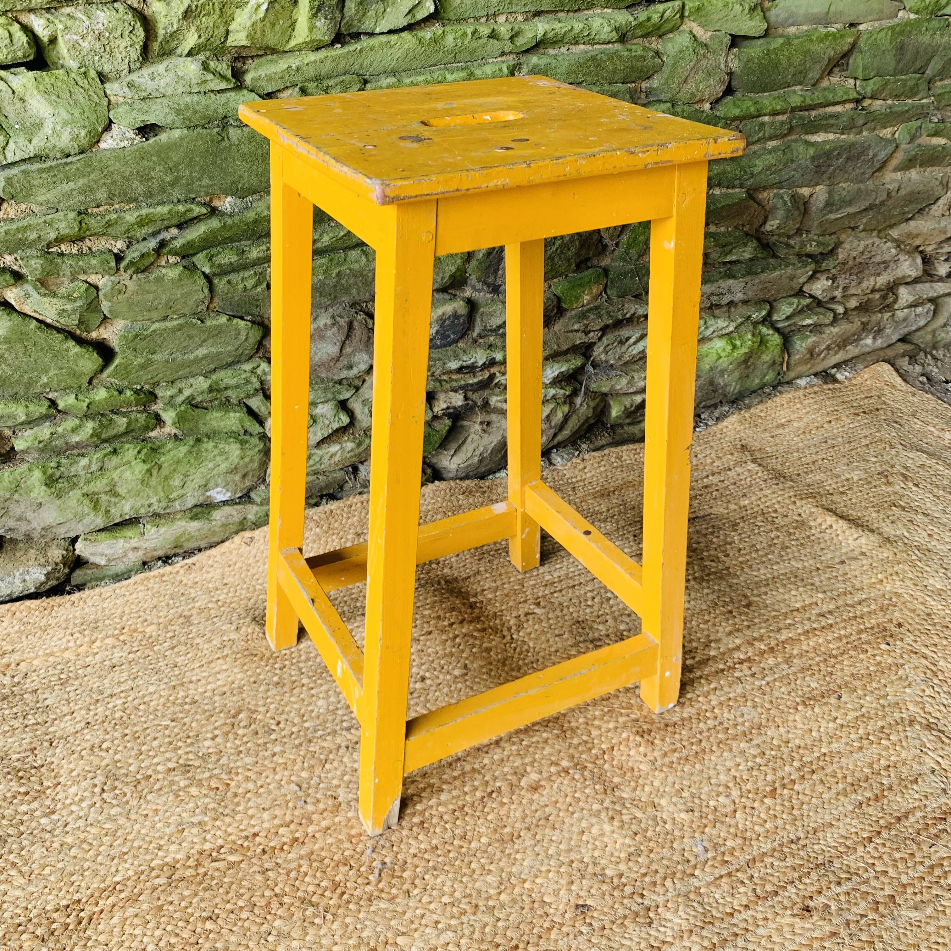 Yellow wooden high stool