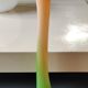 Large Floral Shaped Vase/Ruffled Neck. Blown/opaline art glass. Green/orange tones. Height 39.5 cm