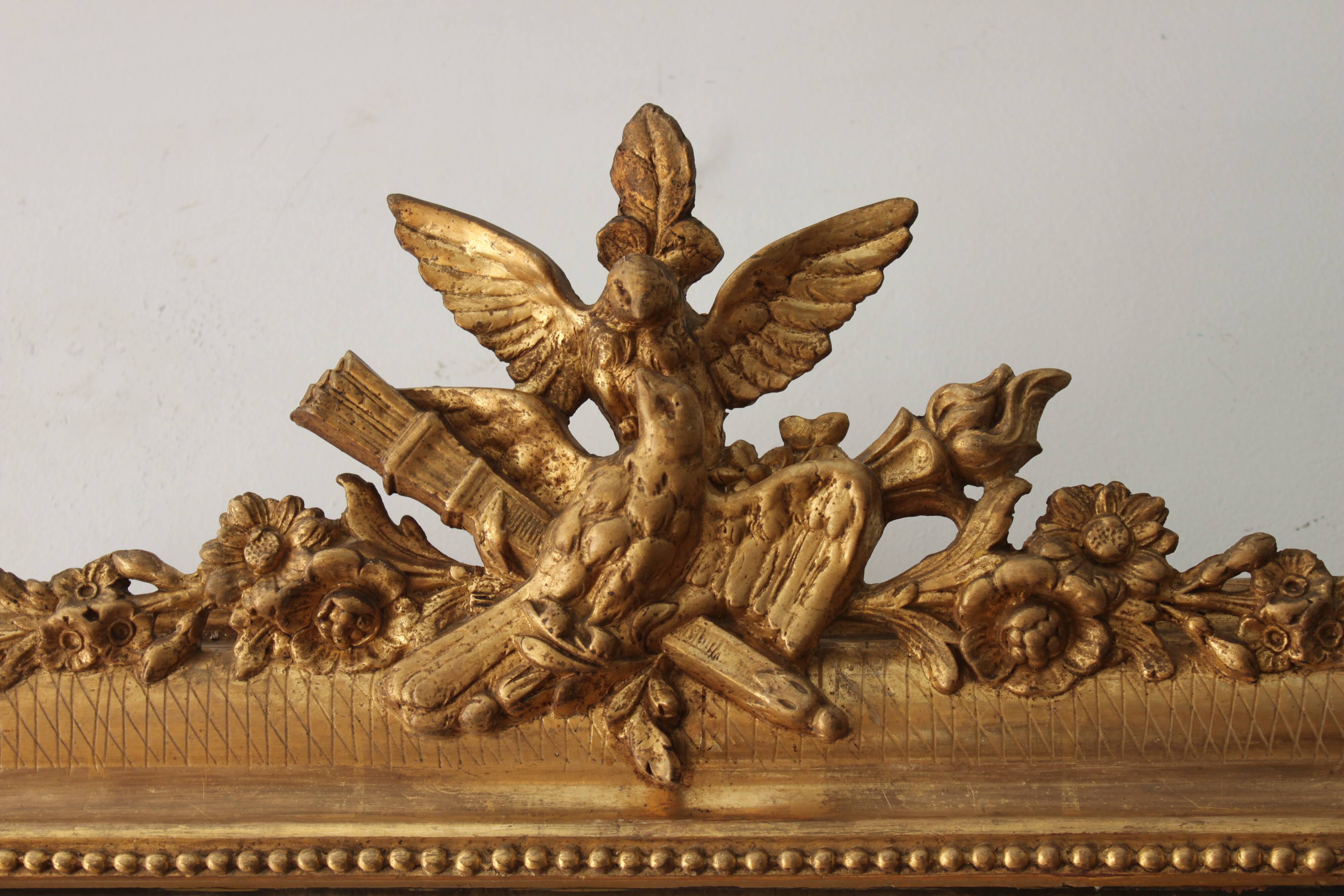 Old gilded mirror with A pediment