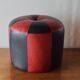 Vintage round pouf in red and black Skai