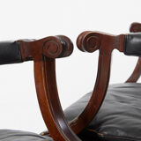 Pairs of black leather Scandinavian armchairs