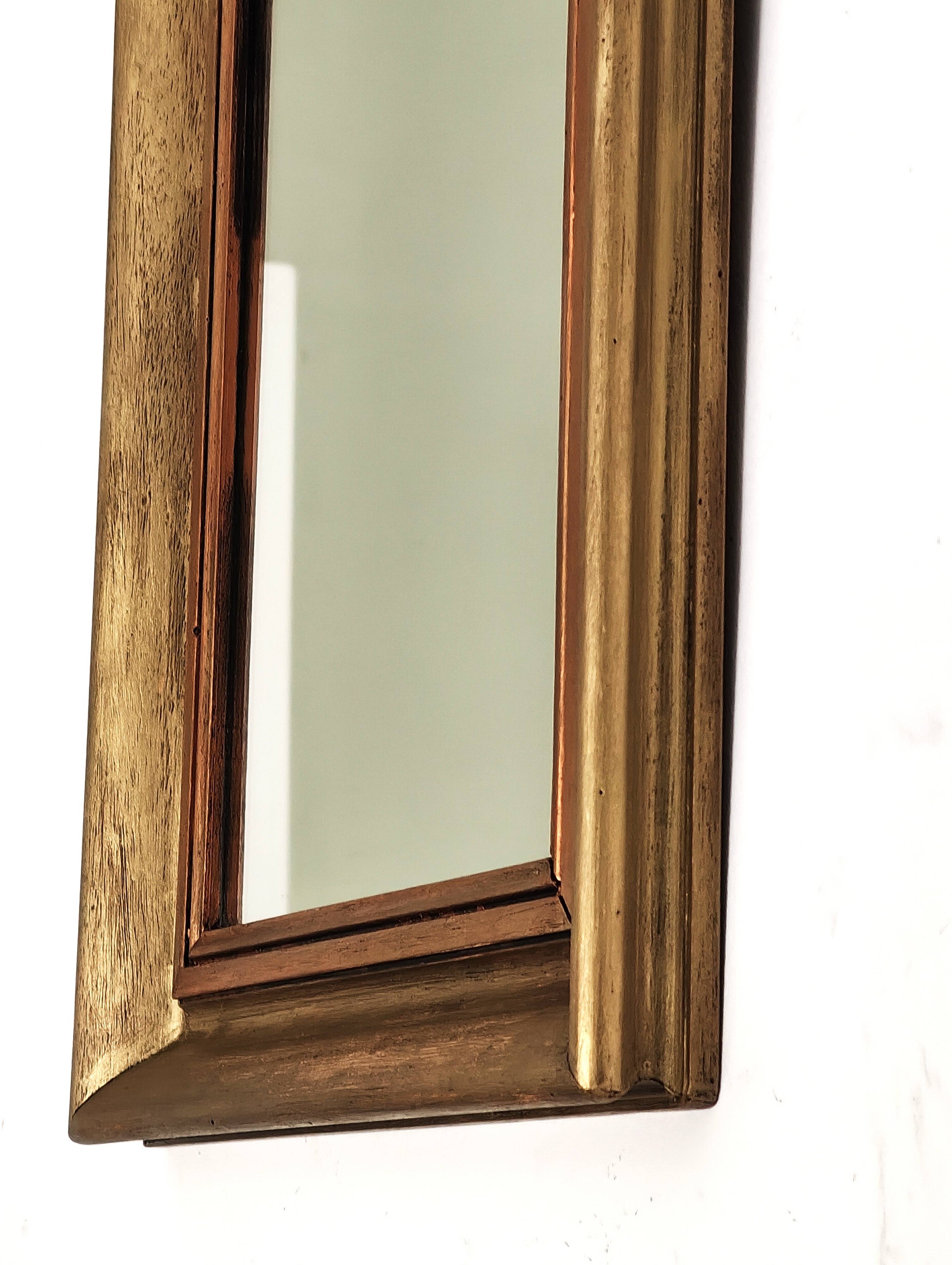 Antique mirror in gilded and copper wood