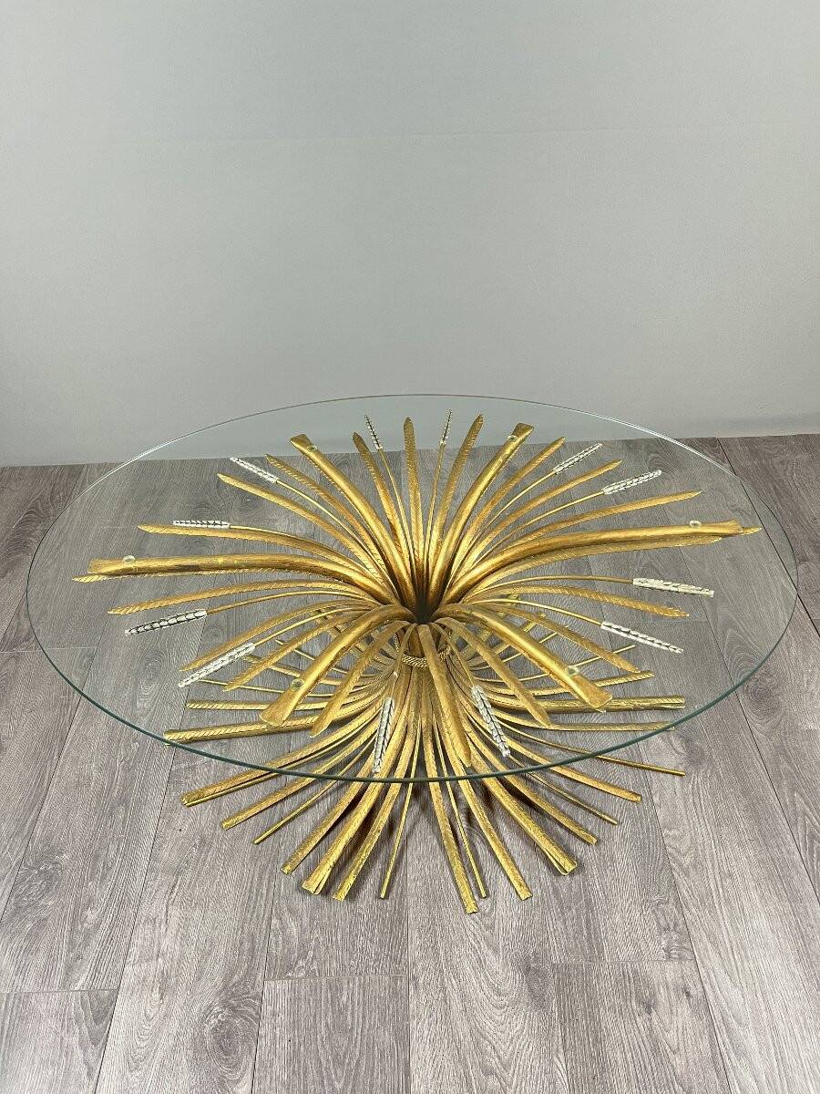 Gold metal and glass coffee table, 20th century, in the style of Robert Goos.