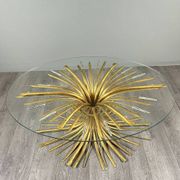 Gold metal and glass coffee table, 20th century, in the style of Robert Goos.
