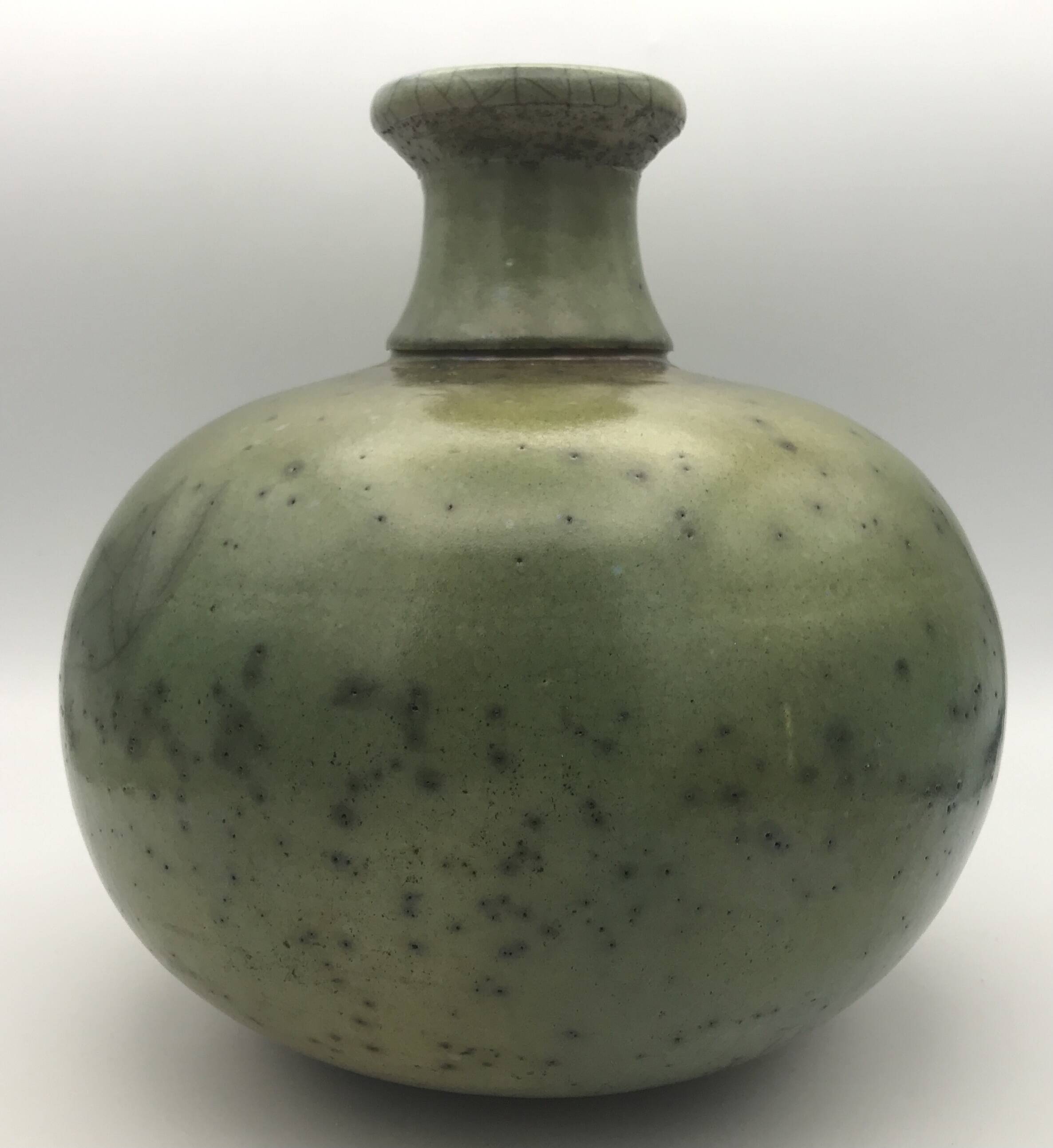 Contemporary vase ball shape raku shades of green and yellow