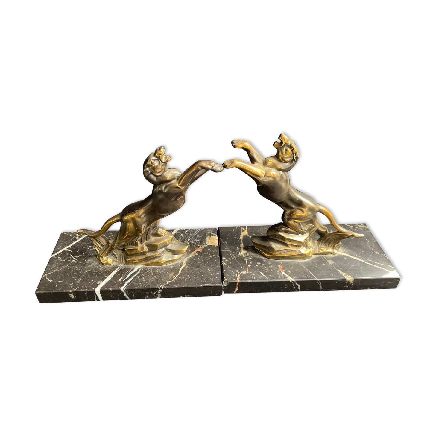 Pair of art deco marble and patinated regulated bookends