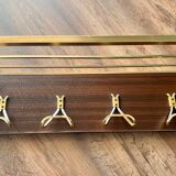 Vintage coat rack with 1970s repai décor