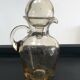 Vintage decanter made of blown glass paste