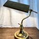 Pair of notary-style lamps in gilded metal