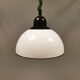 Hanging lamp, in milky white plastic with black top/suspension, probably Danish.