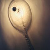 Apply tennis racket in 1980s Plexiglas