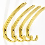 Up to four mid-century brass wall hooks by Herta Baller, Austria, 1950s.