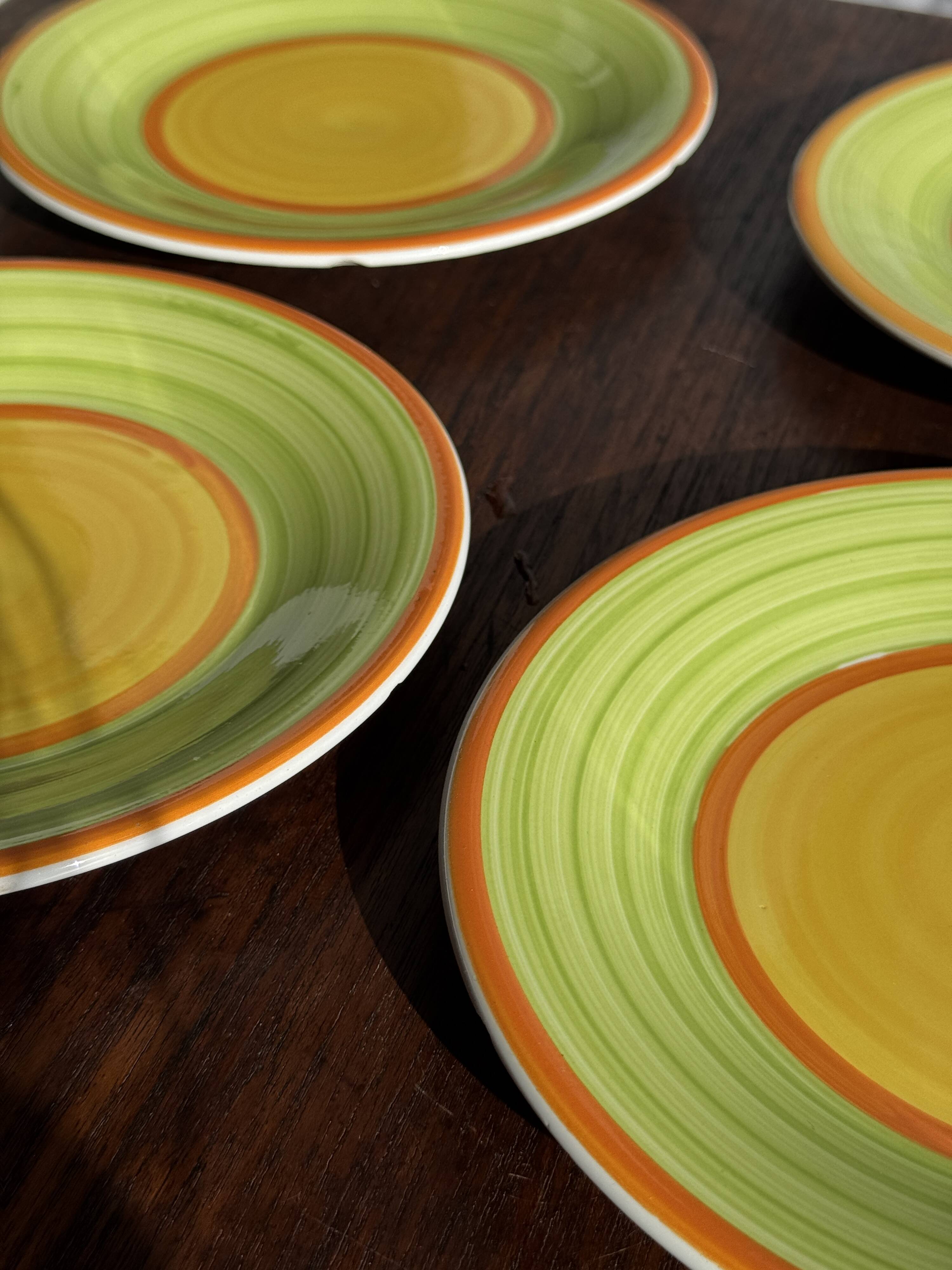 Set of 4 Italian ceramic plates in green, orange, and yellow splashes D20.
