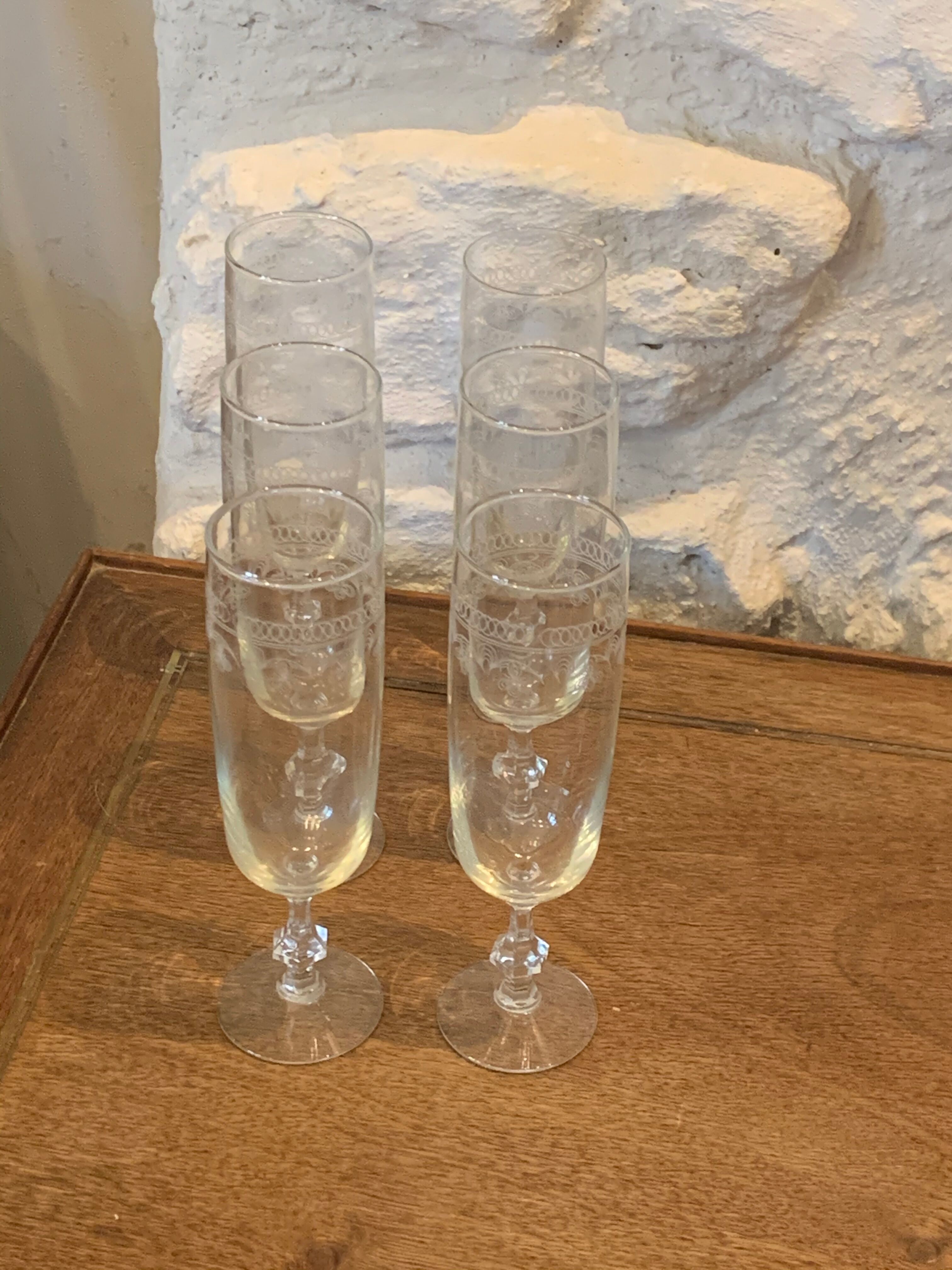6 chiseled champagne flutes on vintage floral frieze pattern