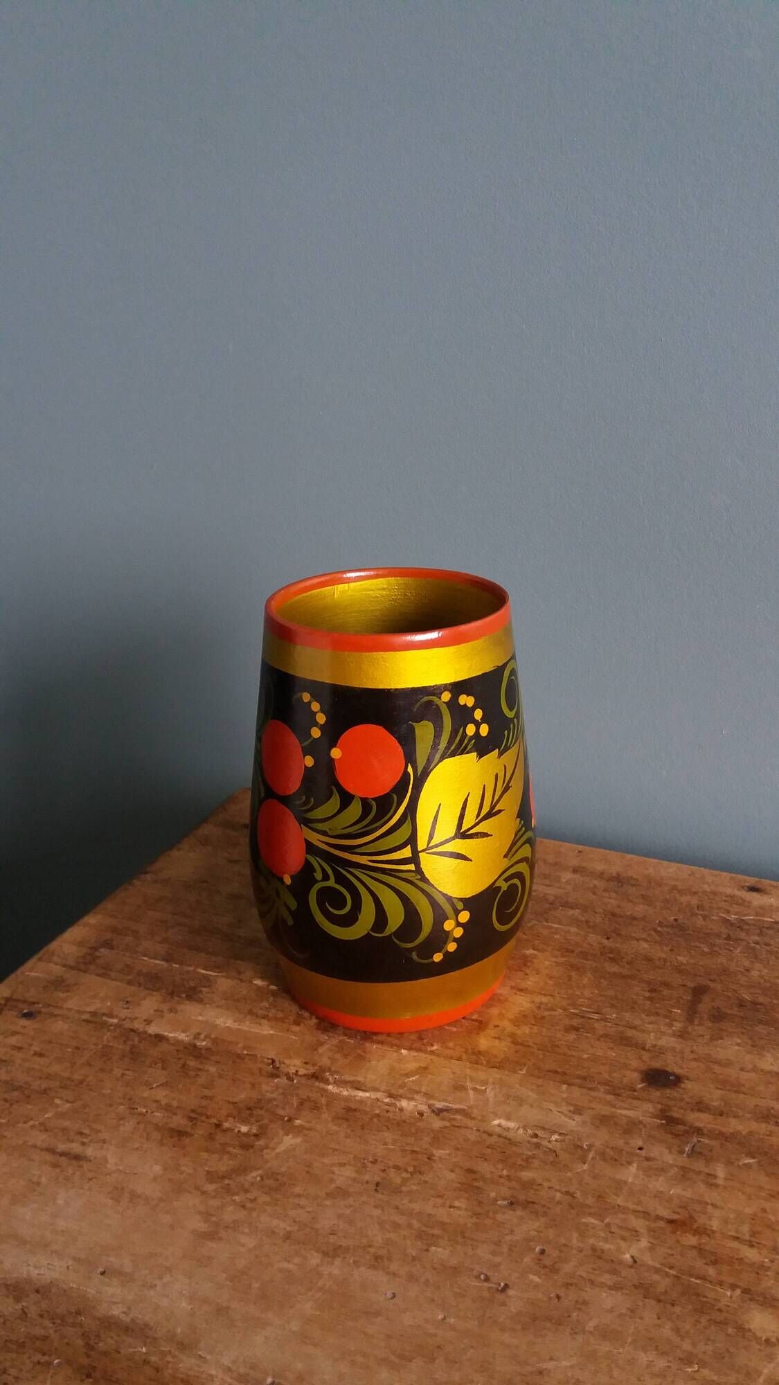 Khokhloma vase, Russian lacquered wood craftsmanship, hand-painted decoration.