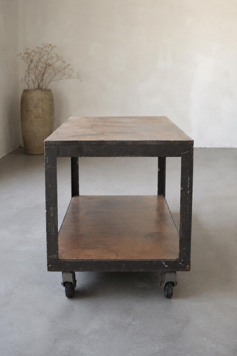 Industrial coffee table in metal and wood, wheeled table, trolley, vintage table, interior decoration.
