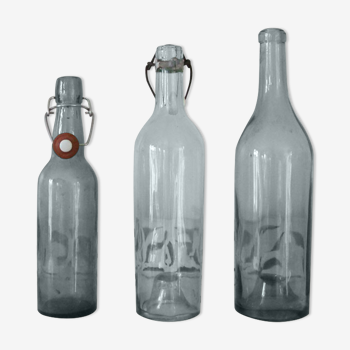 Trio of old glass bottles