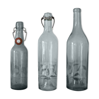 Trio of old glass bottles