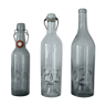 Trio of old glass bottles