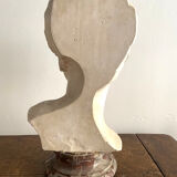 Plaster bust on marble stand