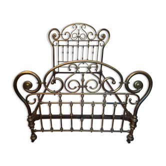 Brass bed with scrolls