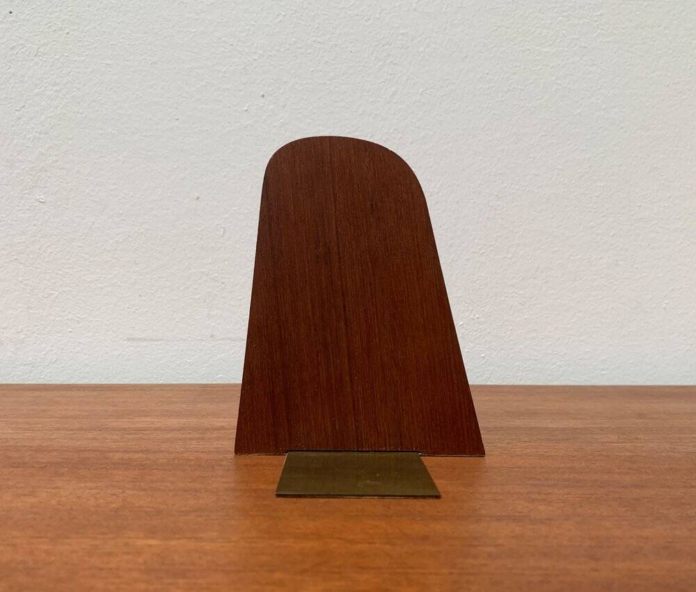 Mid-century Scandinavian bookends in teak and brass.