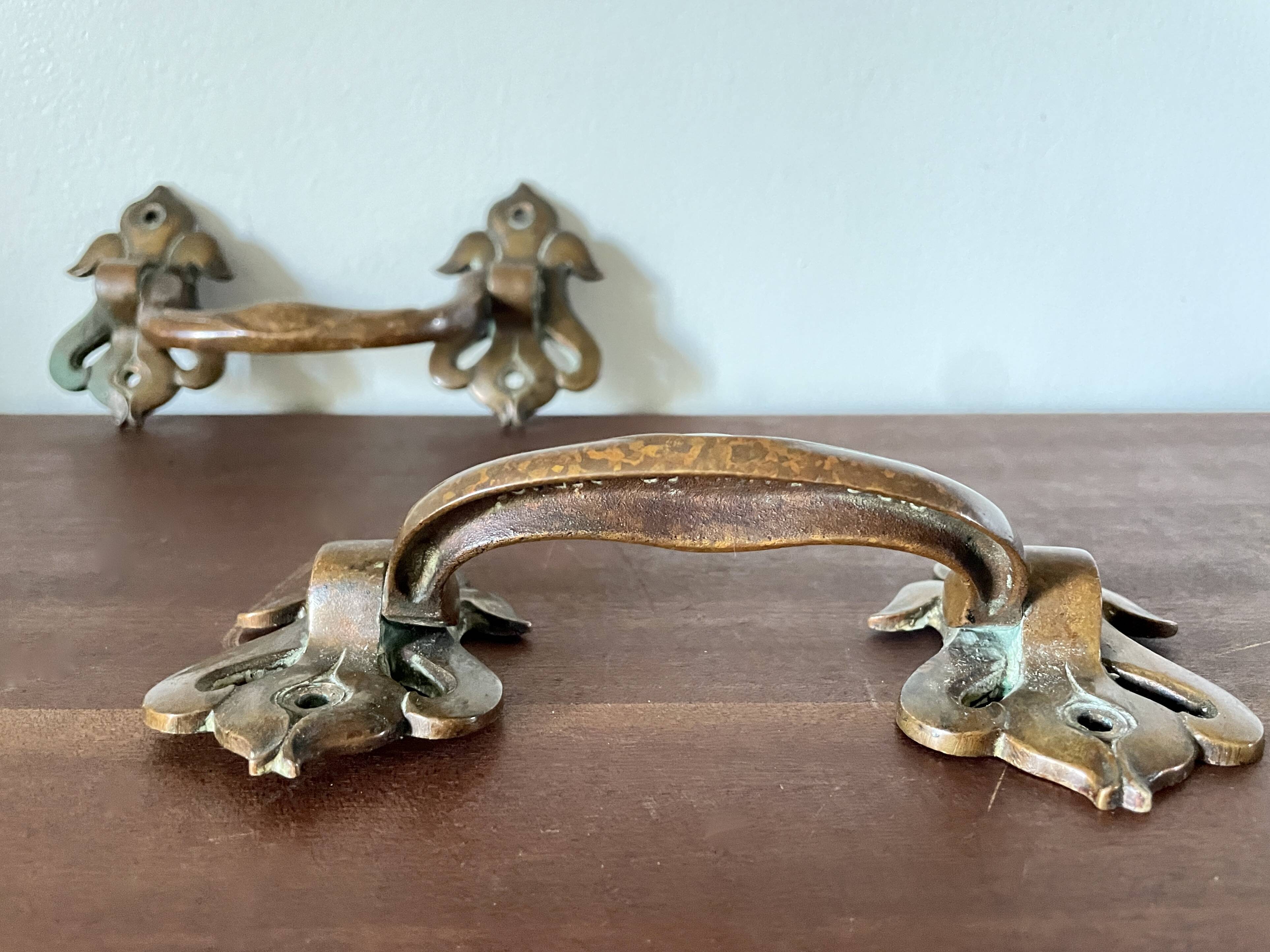 Pair of bronze handles by Emile Muller, 19th century.