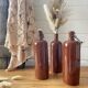 Old hot water bottles in glazed sandstone