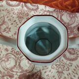 old coffee maker in white earthenware and red edging