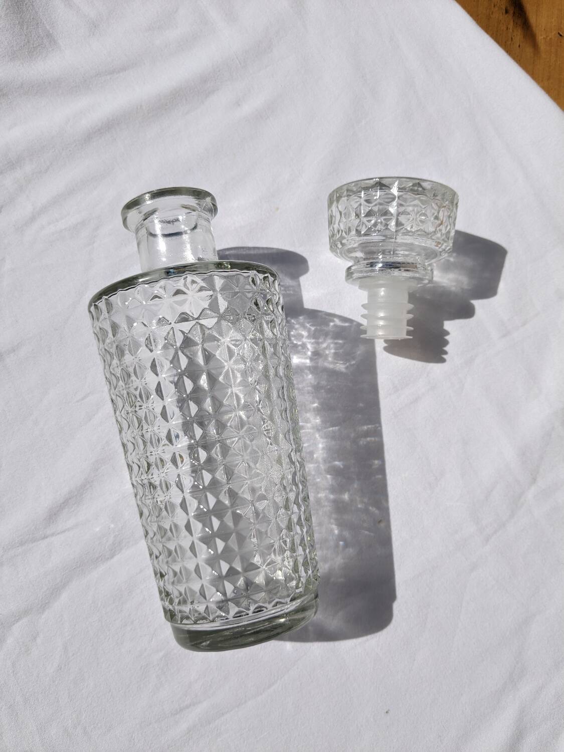 Old relief glass carafe with stopper