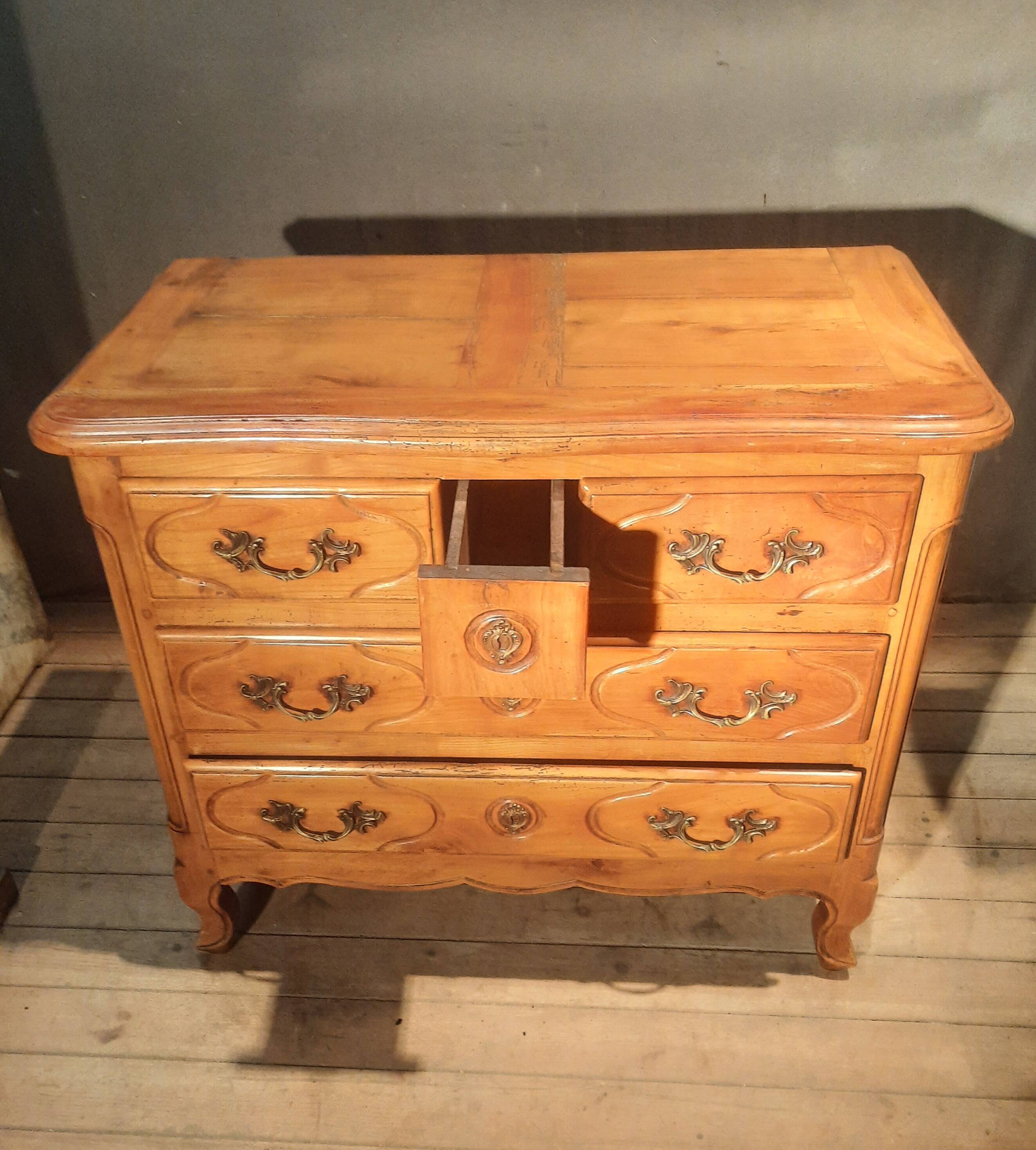 Louis XIV style commode in solid cherry wood.