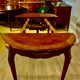 Round table style louis xv, marquetry of rosewood, possibility of extensions.