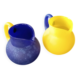 TWO VINTAGE YELLOW AND BLUE GLASS PITCHERS 1990