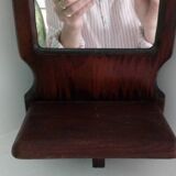 Wooden wall mirror with its shelf