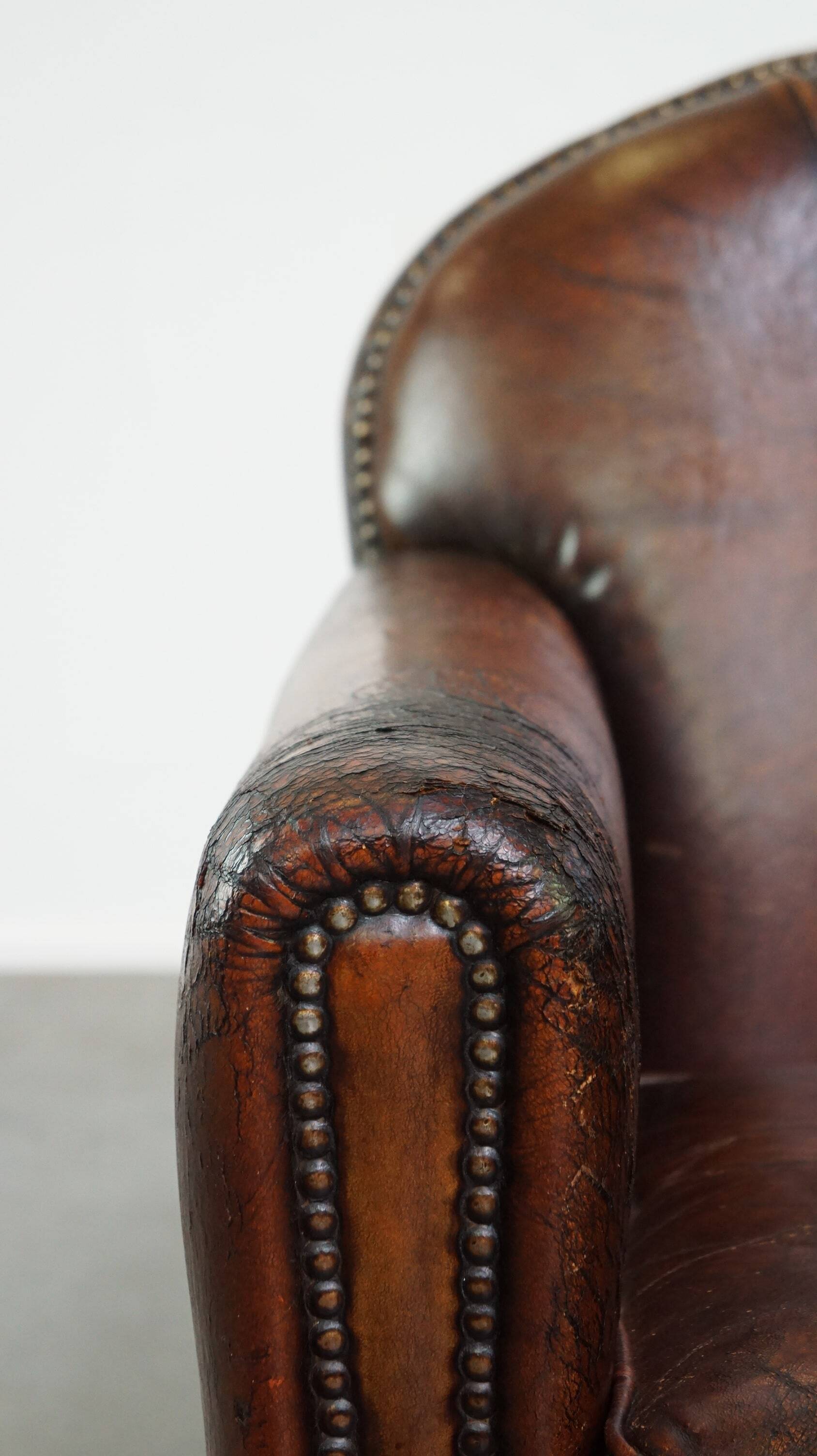 A vintage-style armchair with character, upholstered in beautifully patinated sheepskin.