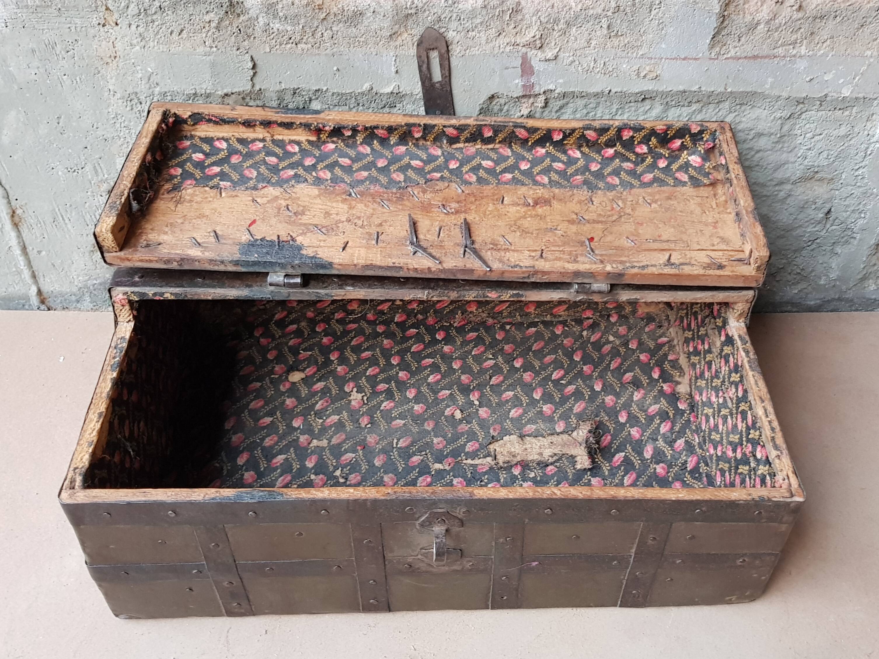 Old tribal chest in hammered metal