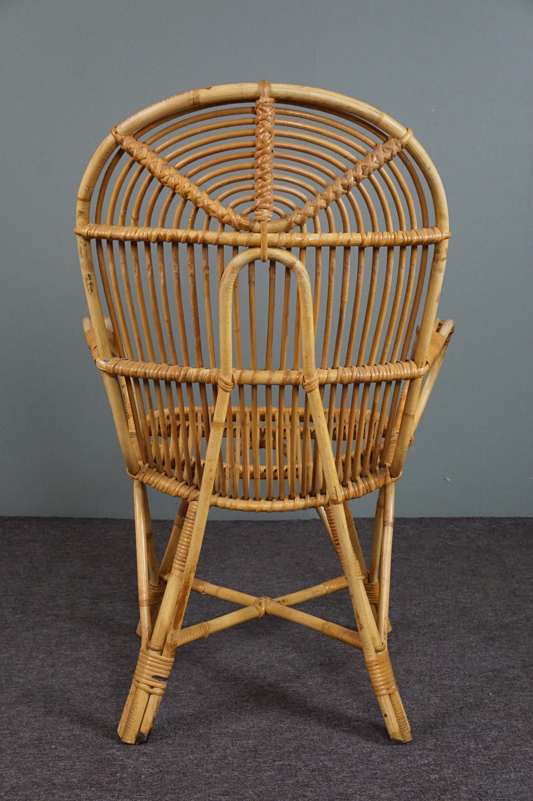 Rattan armchair with armrests by Rohé Noordwolde