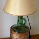 Lampe Dame-jeanne vintage en verre vert et rotin