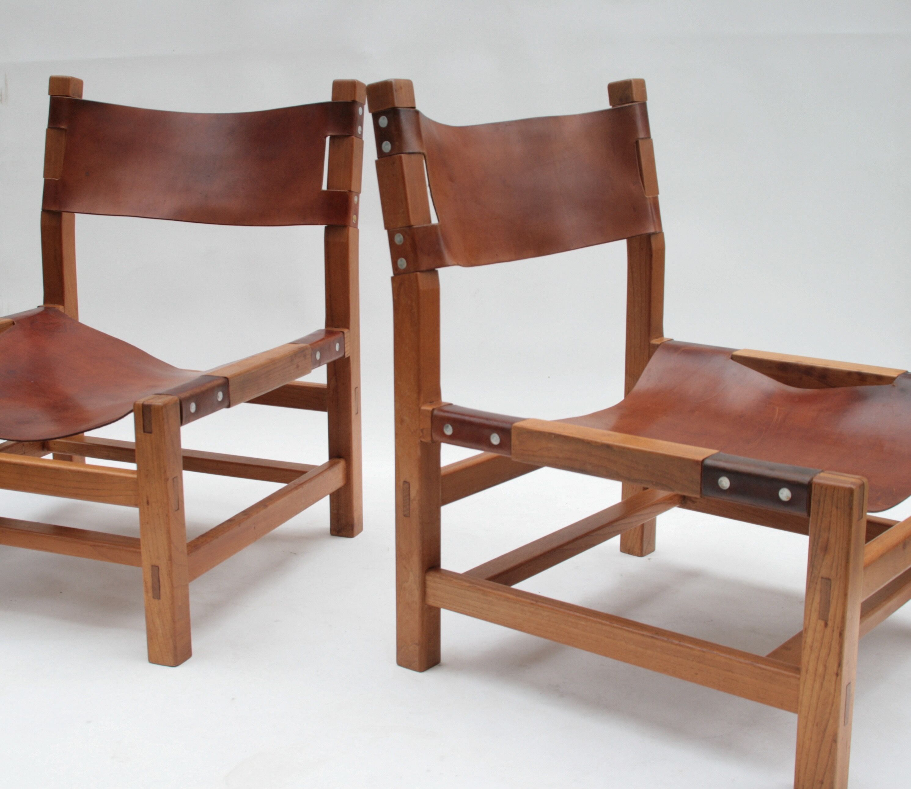 Pair of elm and leather heaters by Maison Regain, 1960s