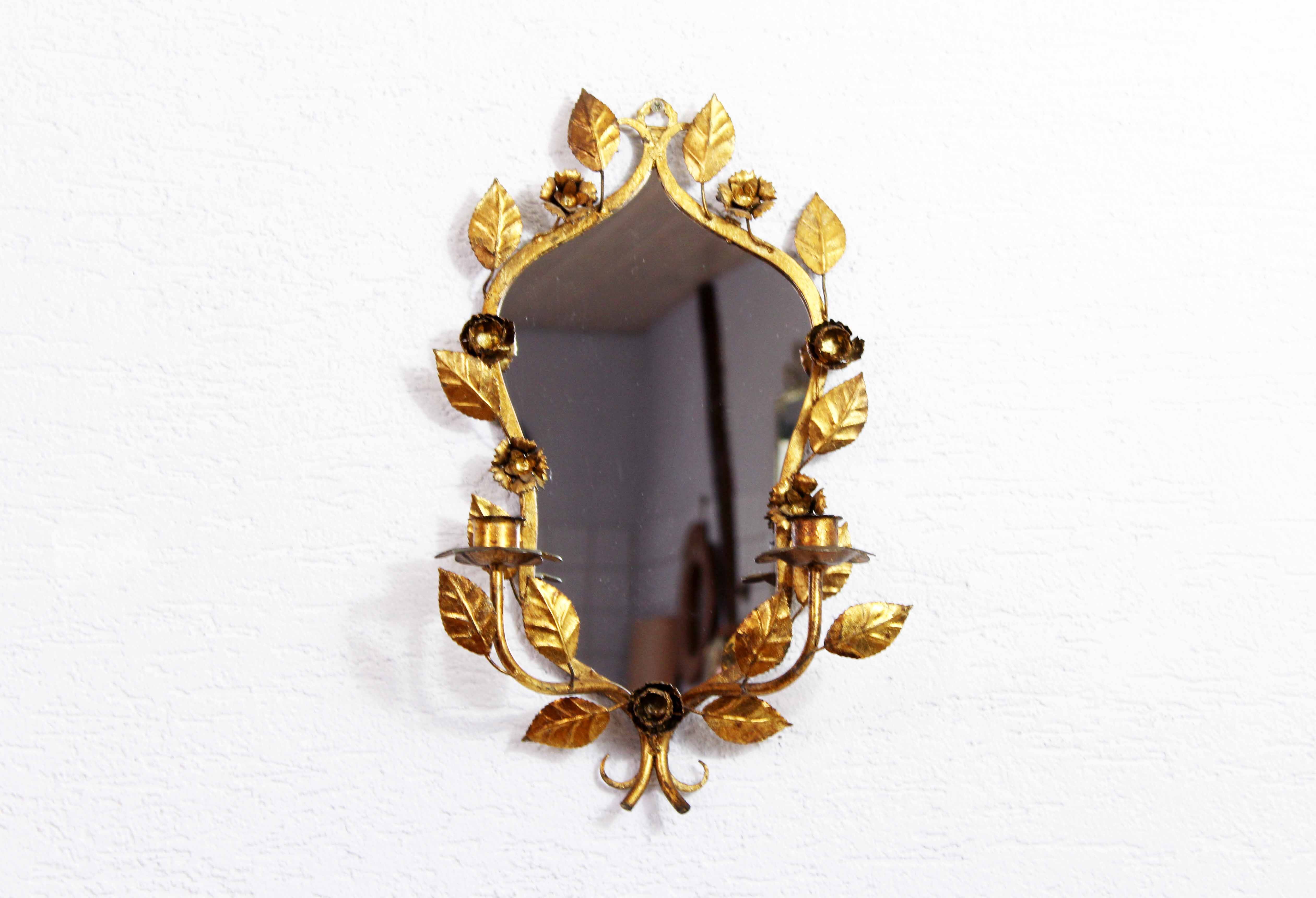Old candlestick mirror gilded with leaf