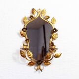 Old candlestick mirror gilded with leaf