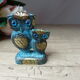 Figure couple two owls of wisdom Greek sculpture