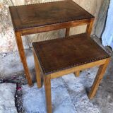 Pair of studded nesting tables and 1930