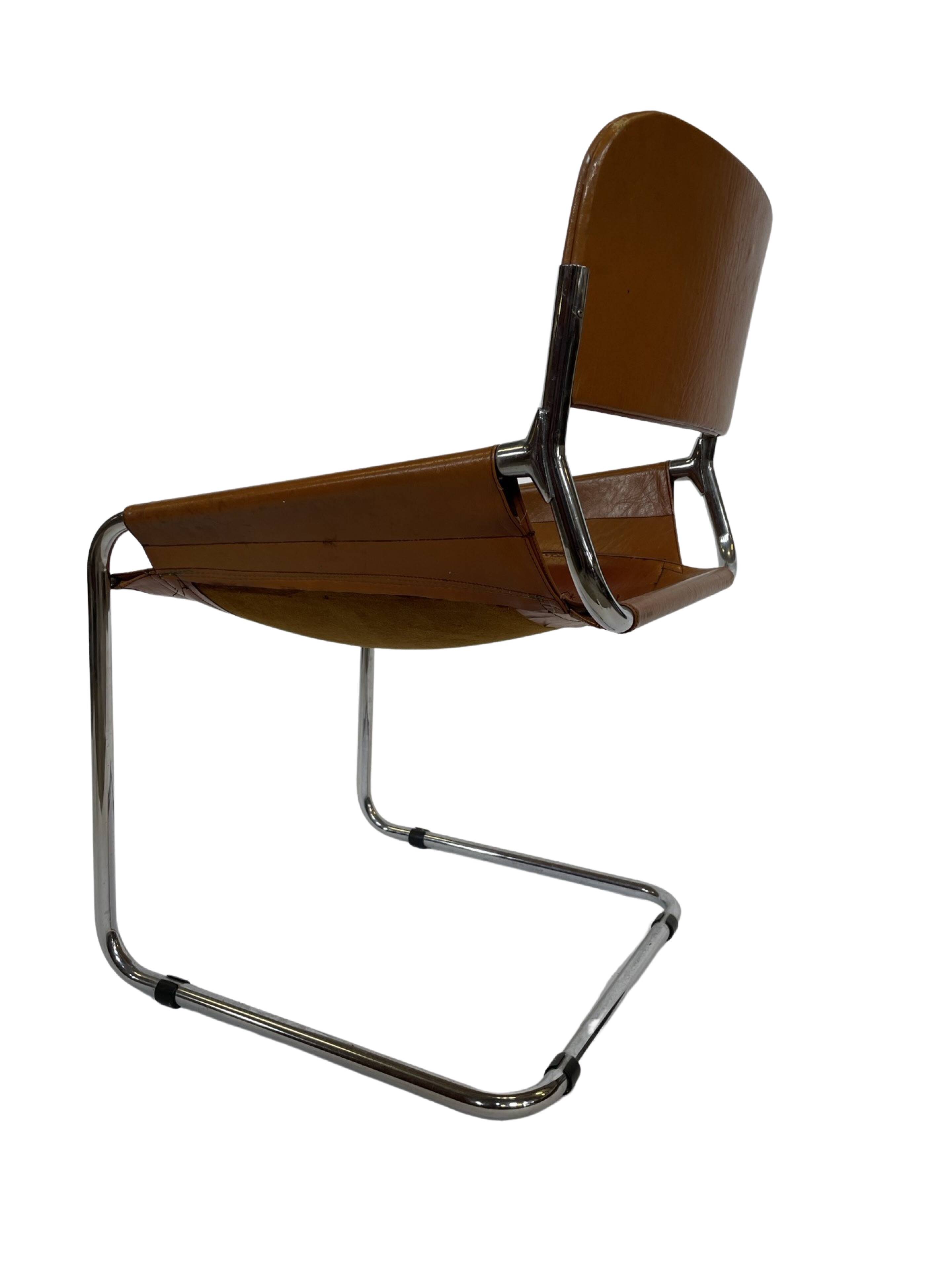 vintage dining room chair in cognac leather and chrome 1970s Italy