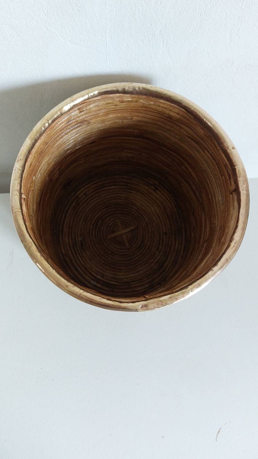 Rattan and brass pot cover