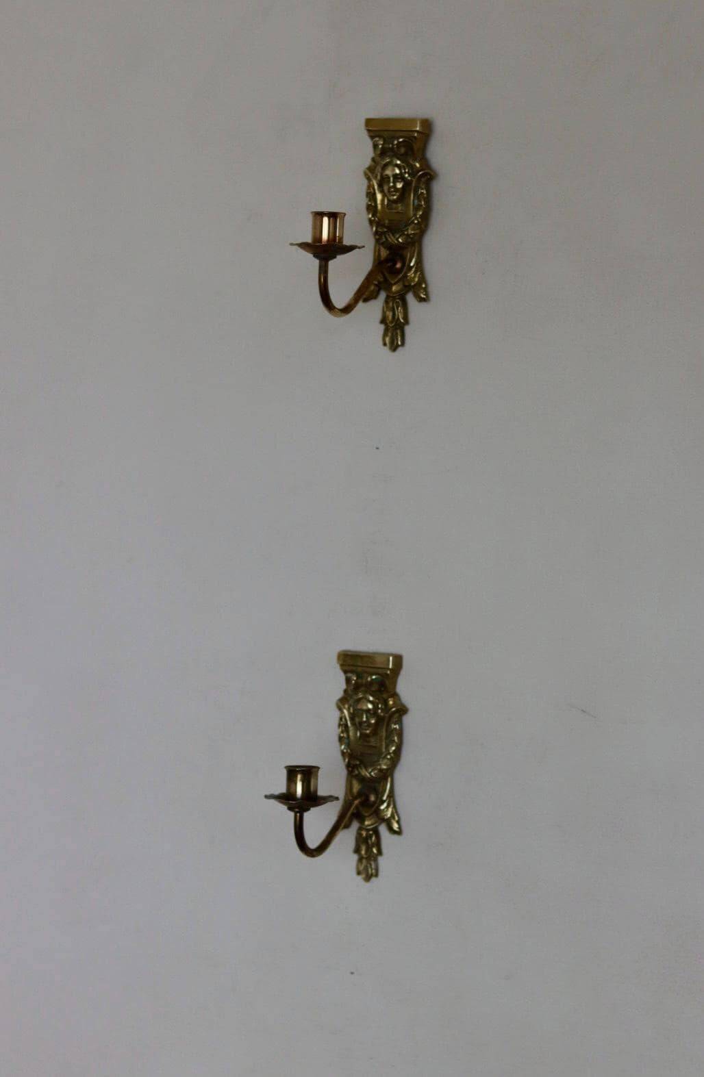 Pair of mid-century Swedish brass face motif sconces