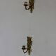 Pair of mid-century Swedish brass face motif sconces
