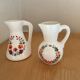 2 pots à lait décor floral (hauteur 9,5 cm )